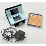 A Nintendo DS with case and charger