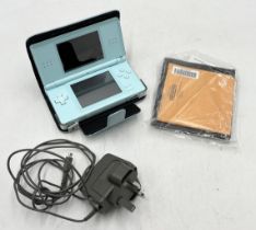 A Nintendo DS with case and charger