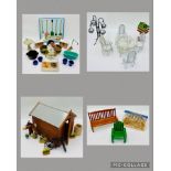 A collection of dolls house accessories relating to the garden including benches, porch swing, table