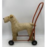 Vintage Childs walker as a Fox Terrier dog raised on solid Rubber Wheels, Made by Lines Brothers