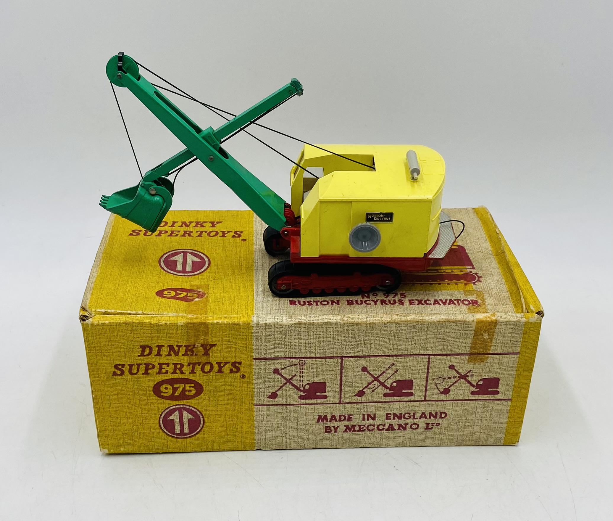 A vintage boxed Dinky Supertoys "Ruston Bucyrus Excavator" die-cast model (No 975) - original tracks