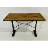 A pub style plank top table on cast iron base 120cm x 67cm, height 72cm