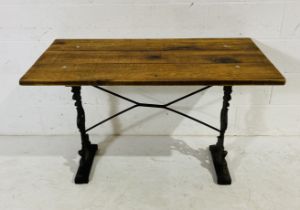 A pub style plank top table on cast iron base 120cm x 67cm, height 72cm