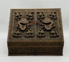 An Oriental heavily carved hardwood stationary box, with key - length 44cm, depth 24cm, height 31cm