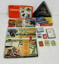 A collection of vintage board games and playing cards including Spear Games Wild Life, Parkers