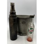 A galvanised Lister bucket along with a Castrol Motor Oil bottle and an Esso lube bottle.
