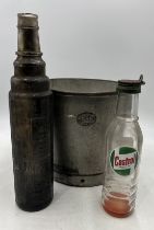 A galvanised Lister bucket along with a Castrol Motor Oil bottle and an Esso lube bottle.