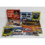 A collection of boxed children's train sets including supersize OO gauge clockwork train set,