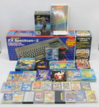 A boxed vintage Sinclair ZX Spectrum +2 Computer, with two boxed joysticks and selection of games