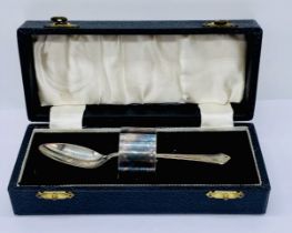 An Elkington silver plated Christening set comprising spoon and napkin ring