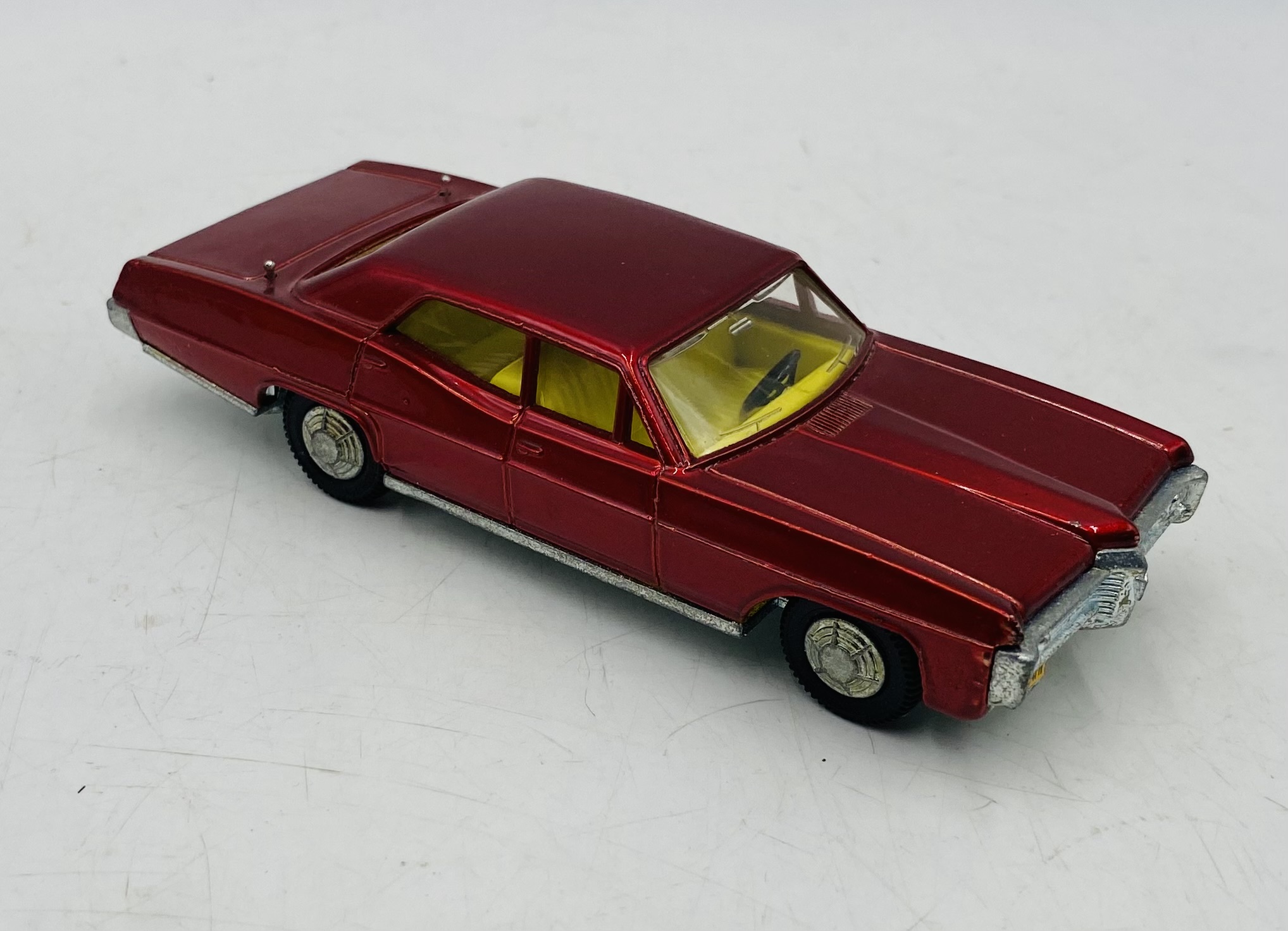 A vintage boxed Dinky Toys Pontiac Parisienne die-cast car in metallic red with a yellow interior ( - Image 4 of 7