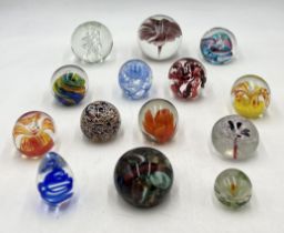 A collection of various paperweights