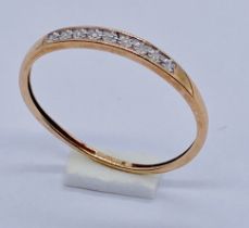 A 9ct gold diamond set half eternity ring, size N 1/2