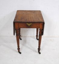 A small Victorian mahogany Pembroke table, with single drawer, raised on turned legs