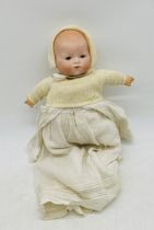 An antique bisque head doll, marked on back with "A.M Germany" (Armand Marseille)