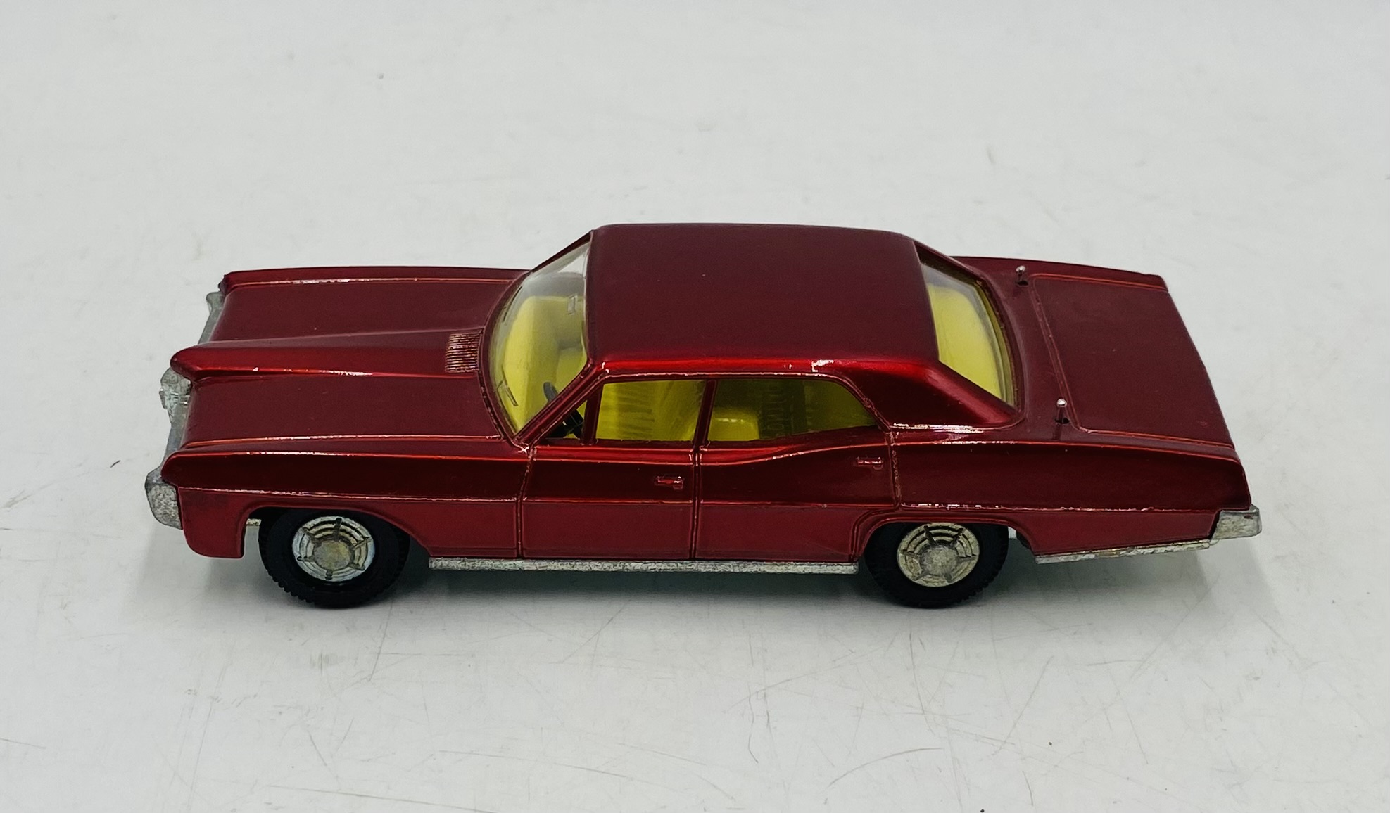 A vintage boxed Dinky Toys Pontiac Parisienne die-cast car in metallic red with a yellow interior ( - Image 2 of 7