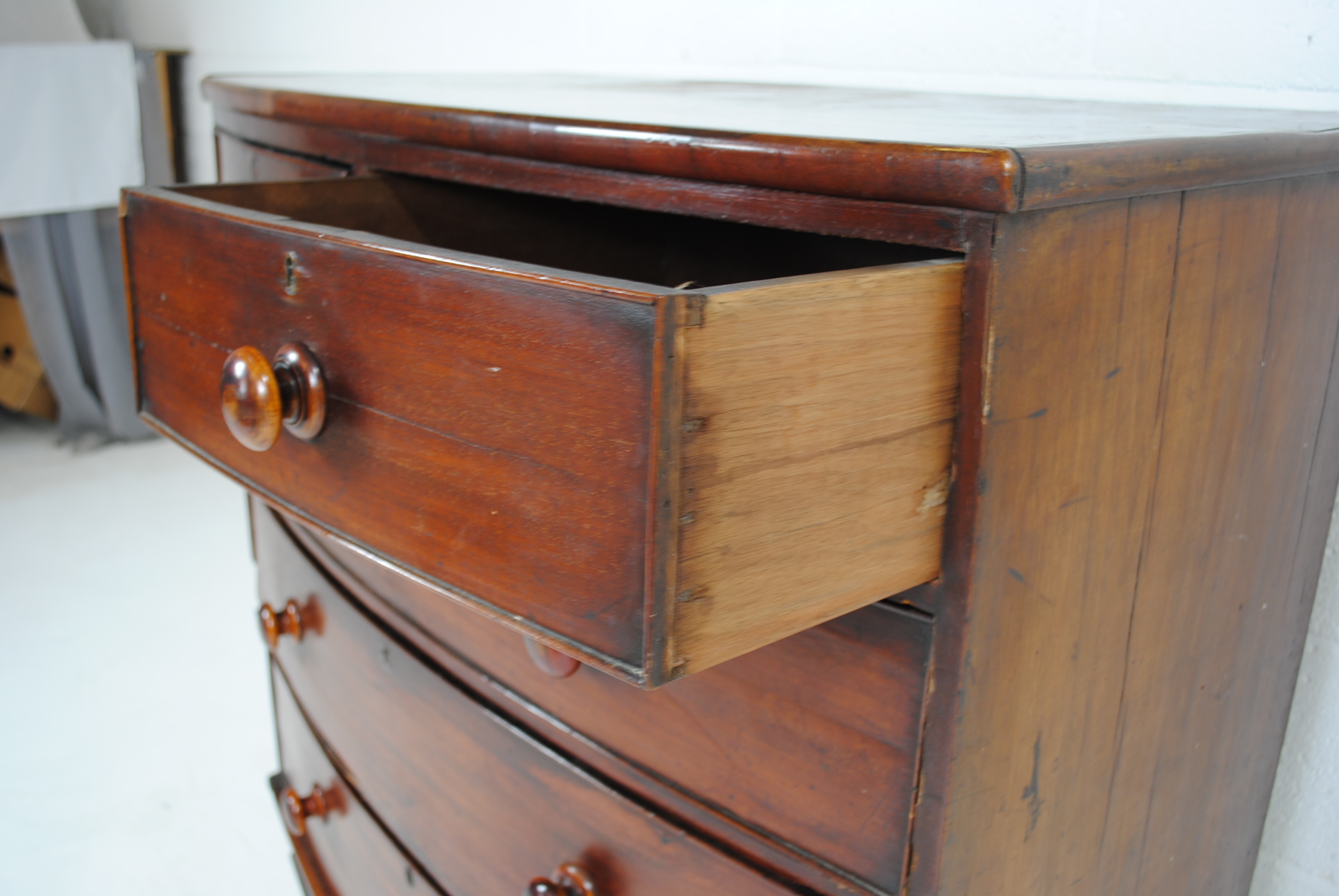 A Victorian mahogany bow-fronted chest of five drawers, raised on turned legs - one leg loose but - Image 6 of 8