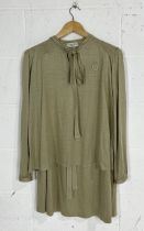 A vintage Christan Dior two piece blouse and skirt set in Khaki