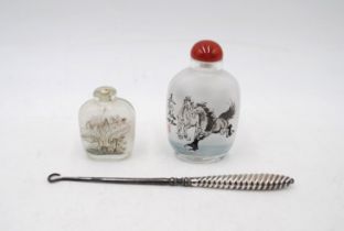 A hallmarked silver handled boot pull, along with two Oriental glass scent bottles (one missing