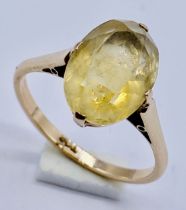 An oval citrine ring (approx. 4ct) set in 9ct gold, size M 1/2