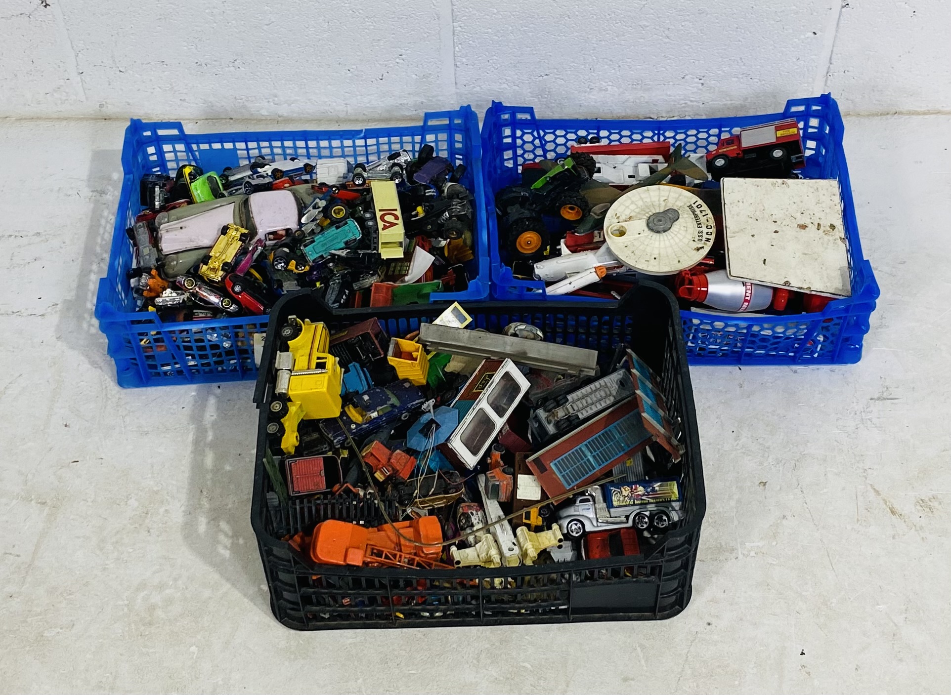Three small crates of playworn die-cast vehicles including Matchbox, Hotwheels, Corgi Toys, Eddie