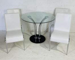A 1980s style glass topped chrome dining table with four white vinyl chairs. Diameter 96cm