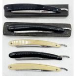 A collection of five cut throat razors