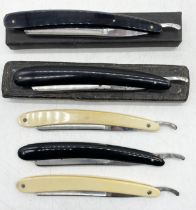 A collection of five cut throat razors