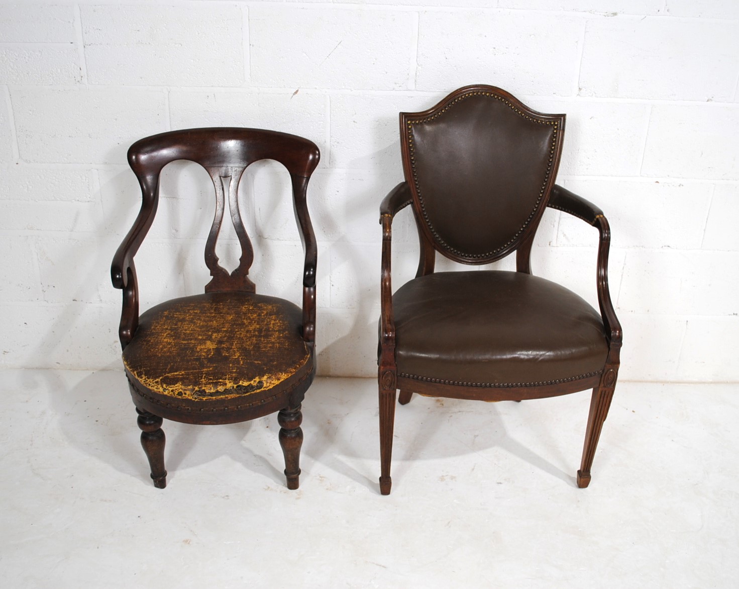 A Victorian mahogany chair, along with an antique mahogany upholstered shield back chair