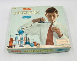 A vintage boxed Merit Chemistry set with 90 experiments by J&L Randell Ltd - looks complete with