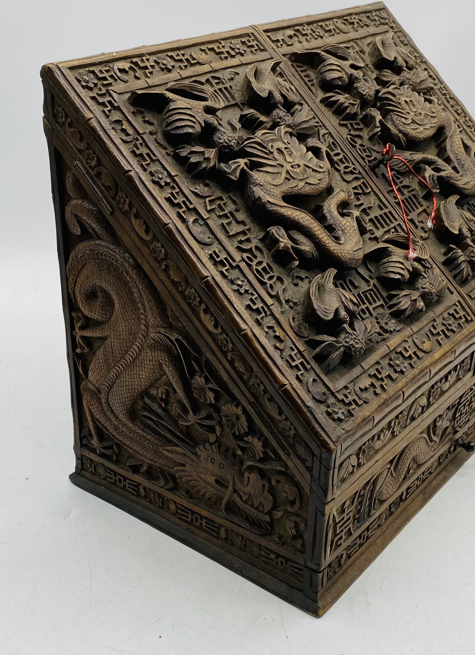 An Oriental heavily carved hardwood stationary box, with key - length 44cm, depth 24cm, height 31cm - Image 6 of 7