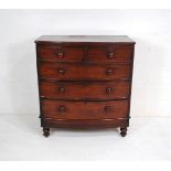 A Victorian mahogany bow-fronted chest of five drawers, raised on turned legs - one leg loose but