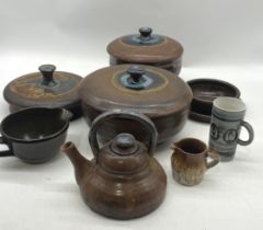 A small collection of studio pottery, several pieces marked "Bristol"