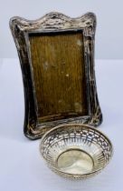 A hallmarked silver bowl by Hamilton & Co. Calcutta along with a silver photo frame (A/F)