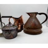 An antique copper large jug with VR seal along another similar and copper kettle with "Good Luck"