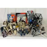 A collection of various Star Wars toy vehicles and Lego (some pre-built), along with other Star Wars