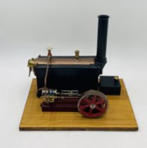A vintage Stuart live steam engine, mounted to wooden base - untested