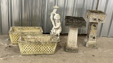 A matched pair of garden troughs along with two sundials etc.