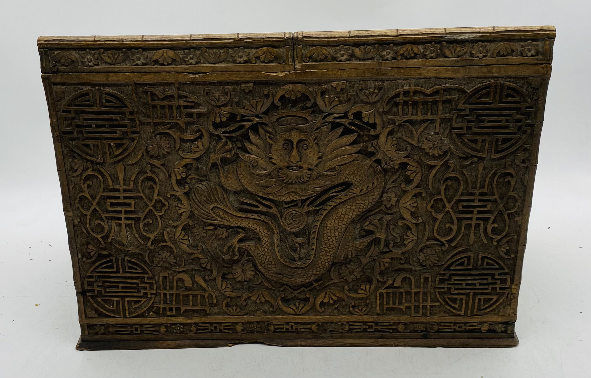An Oriental heavily carved hardwood stationary box, with key - length 44cm, depth 24cm, height 31cm - Image 7 of 7