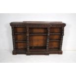 A turn of the century heavily carved oak break-fronted bookcase - some parts loose but present -