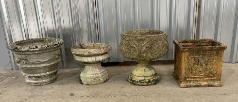 Three reconstituted stone planters including urn on stand along with a weathered terracotta planter