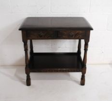 A stained hall table, with two drawers and carved detailing - length 69cm, depth 46cm, height 66cm