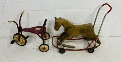 A vintage Lines Bros. (Ireland) Ltd child's push-a-long horse with metal frame, rubber wheels and