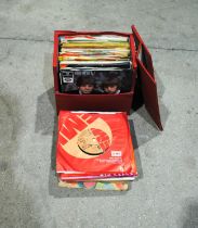 A small quantity of 7" vinyl records, including The Beatles, George Harrison, Millie, Lonnie
