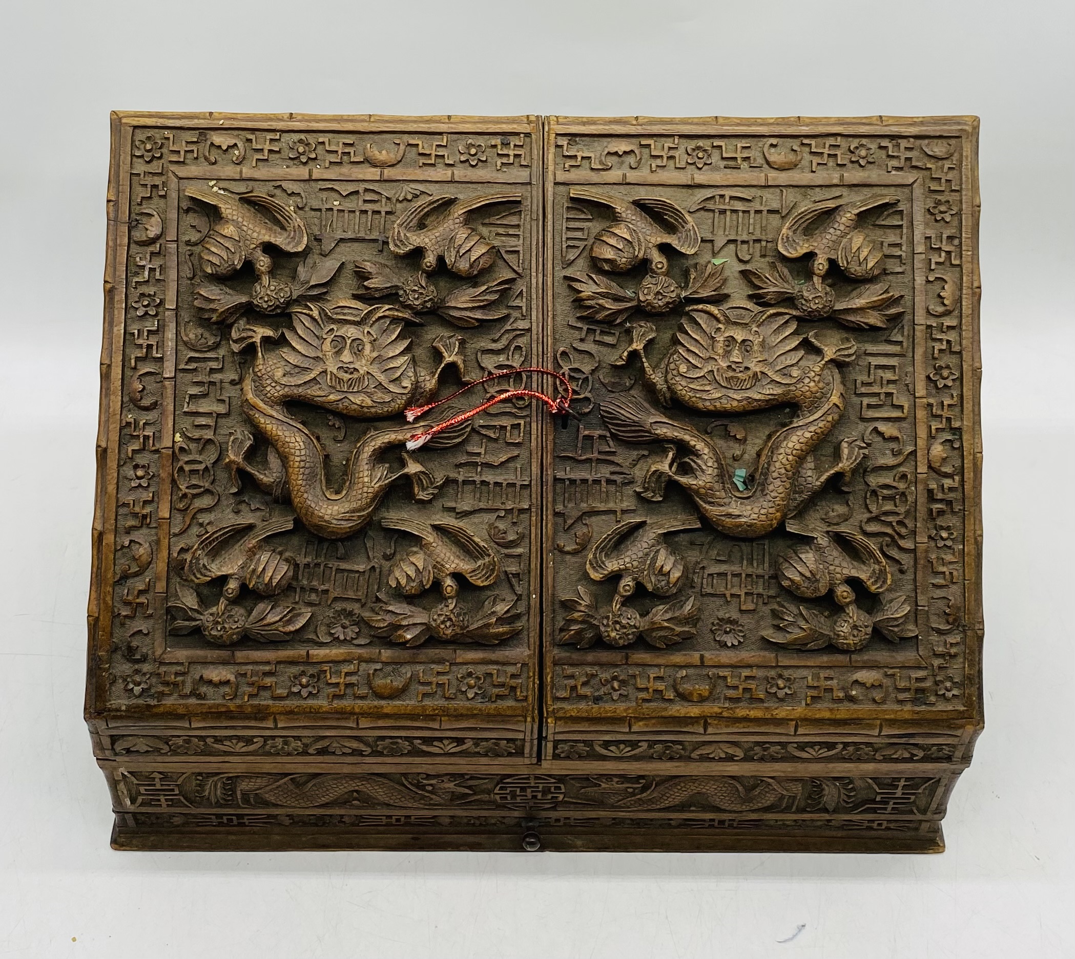 An Oriental heavily carved hardwood stationary box, with key - length 44cm, depth 24cm, height 31cm - Image 2 of 7