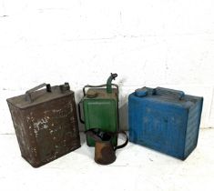 A collection of oil cans including B.P. Shellmex and Esso Blue Paraffin
