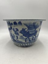 An Oriental blue and white Jardiniere - approximate height 21cm, diameter 31.5cm