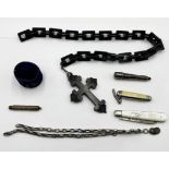 A large jet cross on chain, silver bladed fruit knife, unmarked silver chain etc.