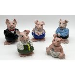 A collection of five Wade Natwest pigs