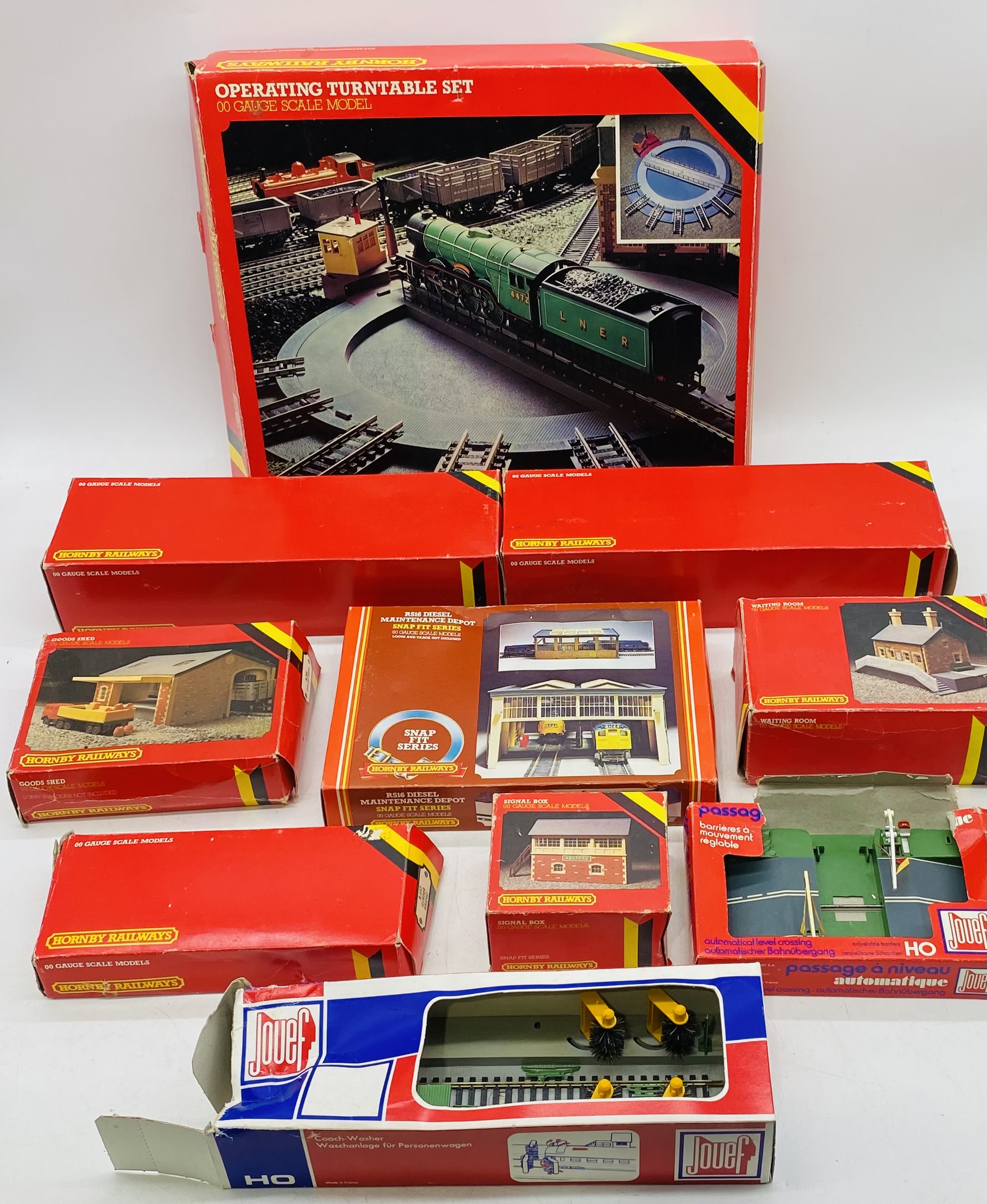 A collection of boxed Hornby Railways OO gauge buildings and accessories including Operating